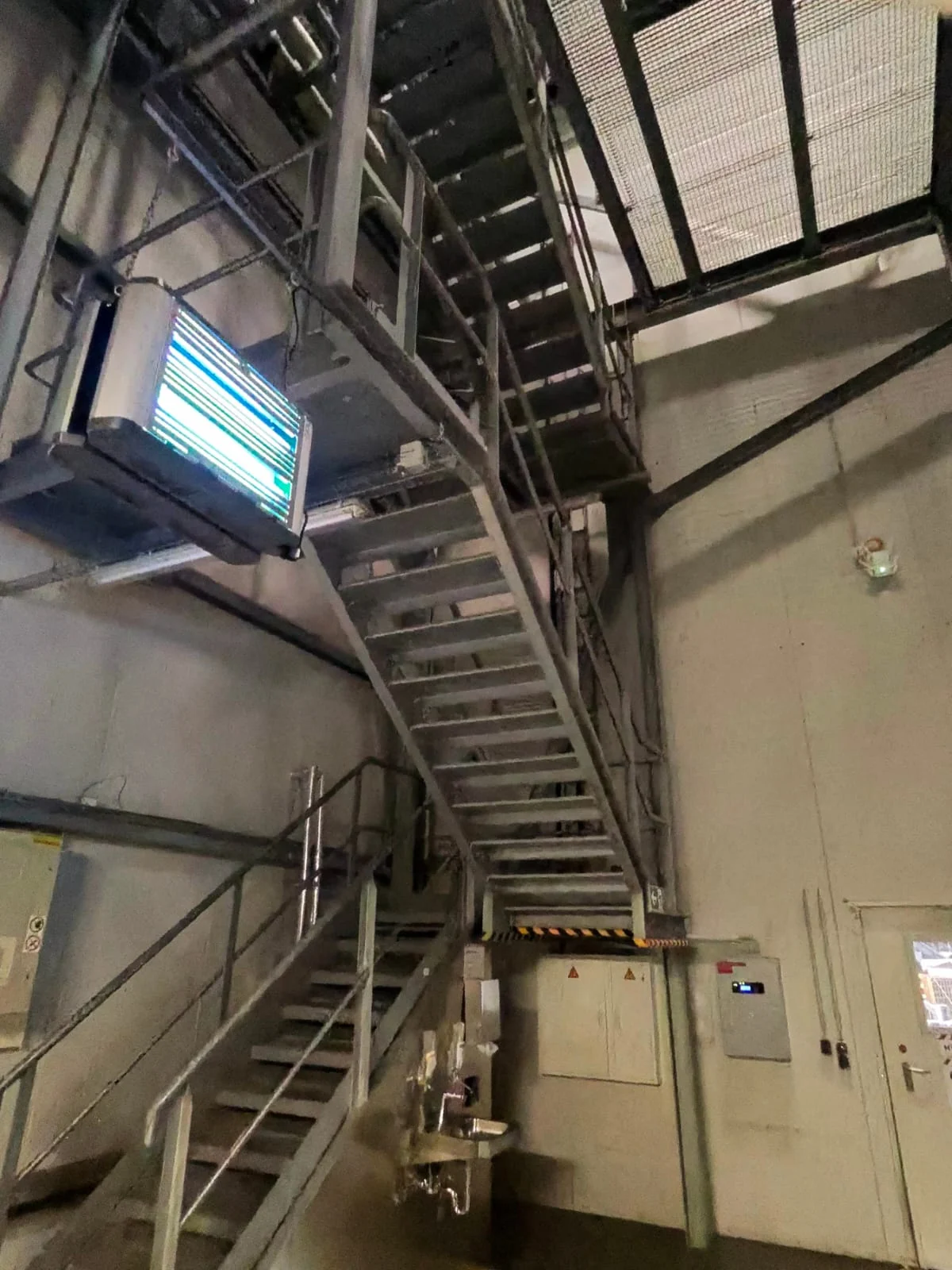 New steel staircase in an industrial hall